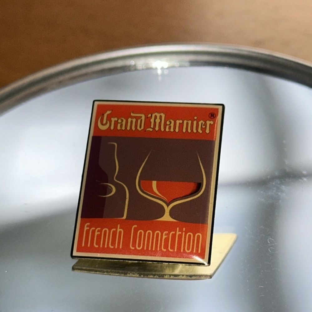 Vintage collectible Grand Marnier FrenchāConnection lapel pinā